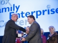 Guy Hill Jr. accepts the award